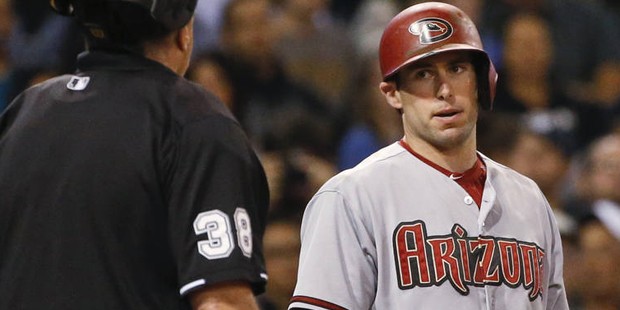 Arizona Diamondbacks' Paul Goldschmidt has words with home plate umpire Gary Cederstrom after being...