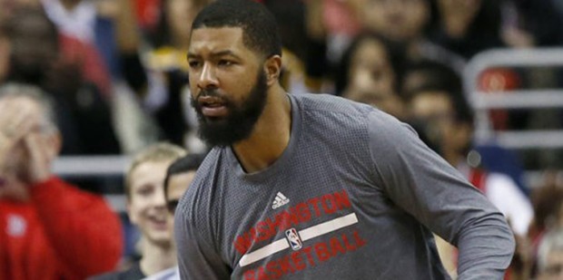 Washington Wizards guard John Wall, left, and forward Markieff Morris react during the second half ...