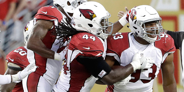 Arizona Cardinals defensive end Calais Campbell (93) celebrates after intercepting a pass against t...