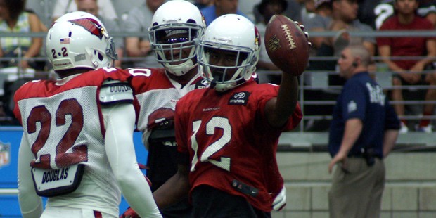 Receiver John Brown holds up the football after scoring a touchdown during Arizona Cardinals traini...