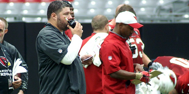 Defensive coordinator James Bettcher calls in a play during training camp Aug. 5. (Photo by Adam Gr...