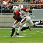 Robert Hughes (39) makes a catch with Edwin Jackson defending at Arizona Cardinals Training Camp in Glendale Tuesday, August 4, 2015. (Photo: Vince Marotta/Arizona Sports)