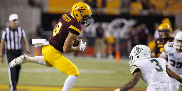 Arizona State's D.J. Foster (8) makes a catch in front of Cal Poly's Kevin Griffin (3) during the f...