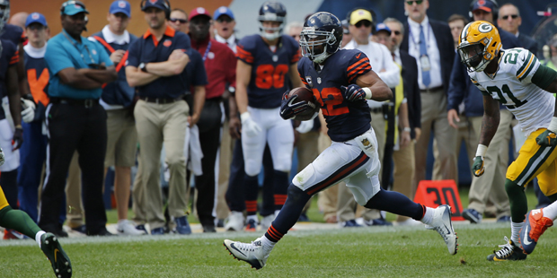 Chicago Bears running back Matt Forte (22) runs against the Green Bay Packers defenders during the ...
