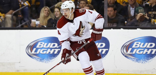 Phoenix Coyotes defenseman Zbynek Michalek looks to pass against the Boston Bruins during the third...