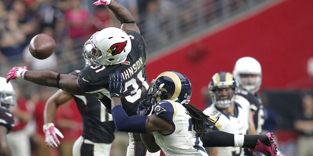 Arizona Cardinals running back David Johnson (31) can't make the catch on fourth down as St. Louis ...