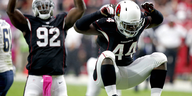 Arizona Cardinals outside linebacker Markus Golden (44) and  defensive end Frostee Rucker (92) cele...