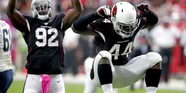 Arizona Cardinals outside linebacker Markus Golden (44) and  defensive end Frostee Rucker (92) cele...