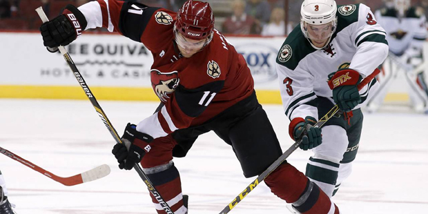 Minnesota Wild's Charlie Coyle (3) and Arizona Coyotes' Martin Hanzal (11), of the Czech Republic, ...
