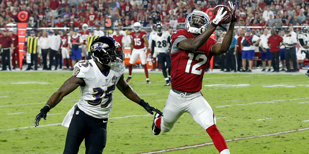 Arizona Cardinals wide receiver John Brown (12) pulls in a pass as Baltimore Ravens defensive back ...