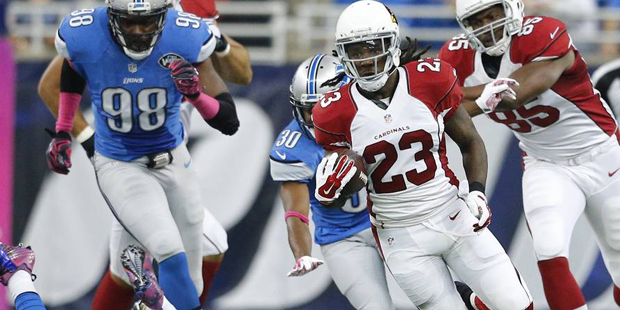 Arizona Cardinals running back Chris Johnson (23) rushes during the first half of an NFL football g...
