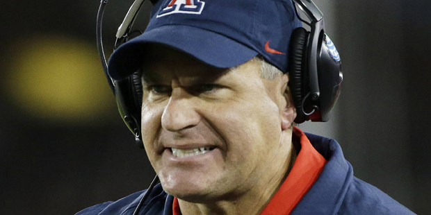 Arizona head coach Rich Rodriguez argues a call during the first half of an NCAA college football g...