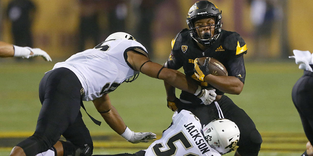 Arizona State running back Demario Richard (4) is hit by Colorado defensive lineman Leo Jackson III...