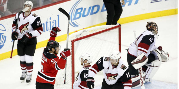New Jersey Devils defenseman Adam Larsson (5), of Sweden, celebrates after scoring the game-winning...