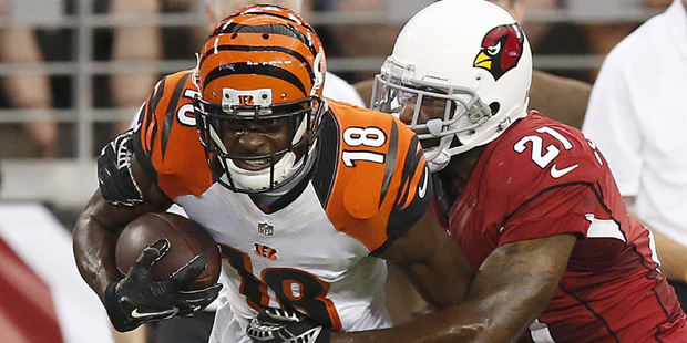 Cincinnati Bengals' A.J. Green (18) runs with the ball after making a catch as Arizona Cardinals' P...