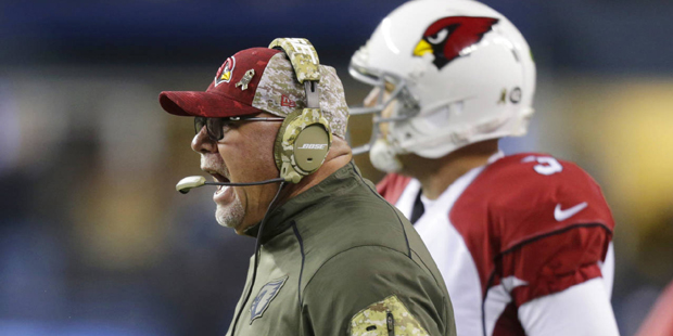 Arizona Cardinals coach Bruce Arians yells as he stands next to quarterback Carson Palmer during th...