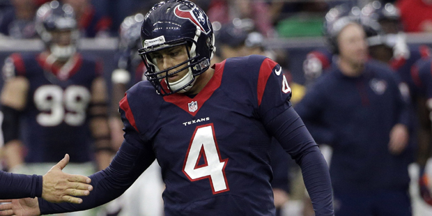 As Baltimore Ravens strong safety Jeromy Miles (36) looks on, Houston Texans kicker Randy Bullock (...