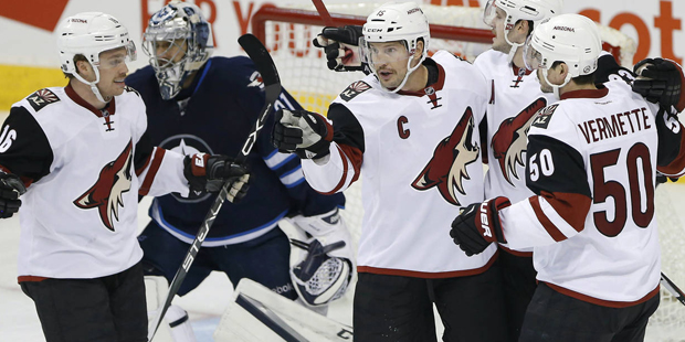 Arizona Coyotes' Max Domi (16), Shane Doan (19), Oliver Ekman-Larsson (23) and Antoine Vermette (50...