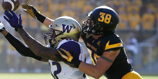 Arizona State's Jordan Simone (38) tips a pass away from Washington's Joshua Perkins, left, during ...