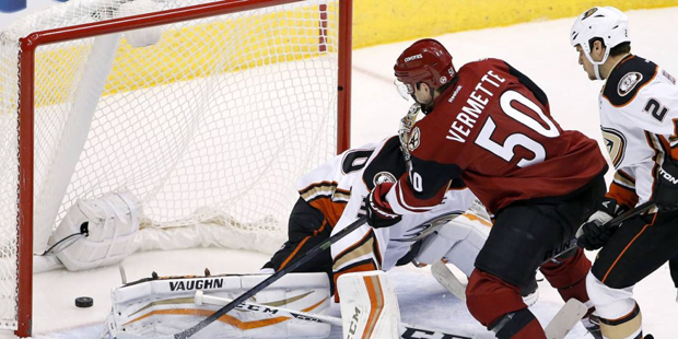 Arizona Coyotes' Antoine Vermette (50) scores a goal against Anaheim Ducks' John Gibson, left, as D...