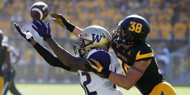 Arizona State's Jordan Simone (38) tips a pass away from Washington's Joshua Perkins, left, during ...