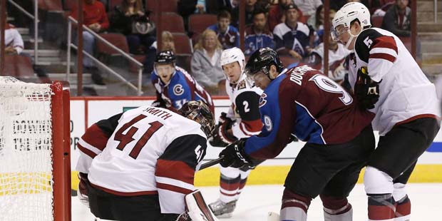 Arizona Coyotes' Mike Smith (41) makes a kick-save on a shot by Colorado Avalanche's Matt Duchene (...