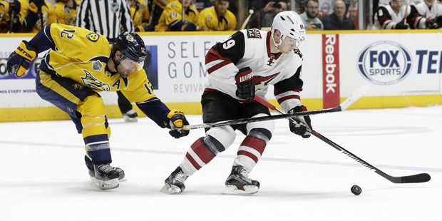 Arizona Coyotes left wing Mikkel Boedker (89), of Denmark, is defended by Nashville Predators' Mike...