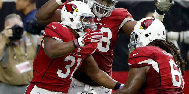 Arizona Cardinals running back David Johnson (31) celebrates with teammates Jonathan Cooper (61) an...