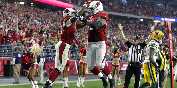 Arizona Cardinals running back David Johnson (31) celebrates his touchdown with teammate Mike Iupat...