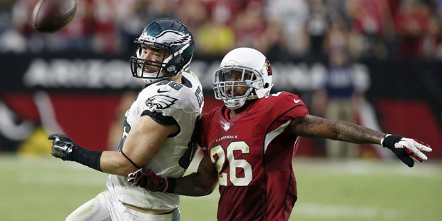 Philadelphia Eagles' Zach Ertz (86) is overthrown as Arizona Cardinals' Rashad Johnson (26) defends...