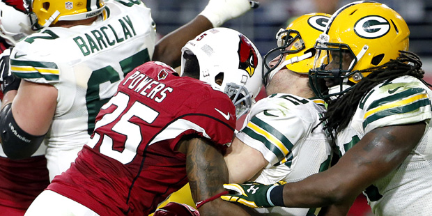 Green Bay Packers quarterback Aaron Rodgers (12) is sacked by Arizona Cardinals cornerback Jerraud ...