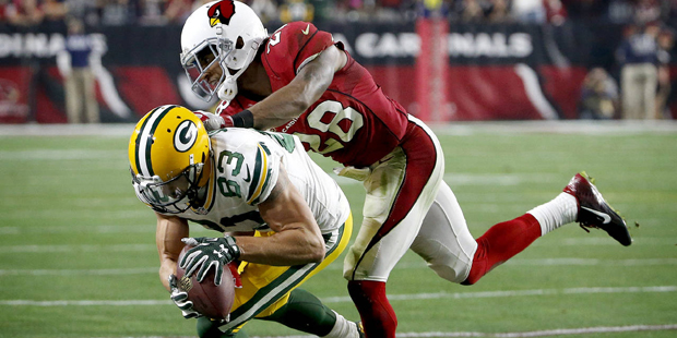 Green Bay Packers wide receiver Jeff Janis (83) is knocked out of bounds by Arizona Cardinals corne...