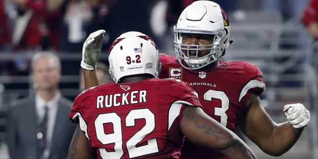 Arizona Cardinals defensive end Calais Campbell (93) and  defensive end Frostee Rucker (92) celebra...