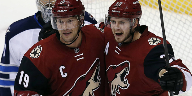 Arizona Coyotes defenseman Oliver Ekman-Larsson celebrates with Shane Doan (19) after scoring durin...