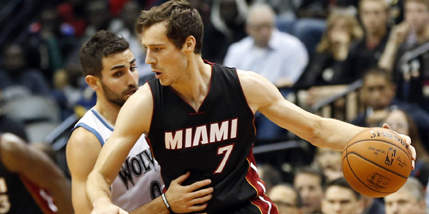 Minnesota Timberwolves Ricky Rubio, left, of Spain, tries to slow up Miami Heats Goran Dragic, ...