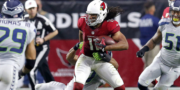 Arizona Cardinals wide receiver Larry Fitzgerald (11) makes a catch as Seattle Seahawks free safety...