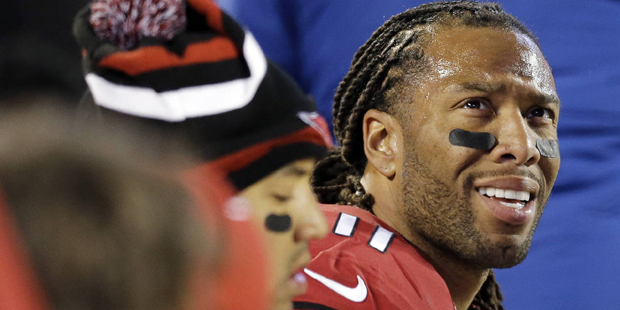 Arizona Cardinals' Larry Fitzgerald looks at the scoreboard during the second half the NFL football...