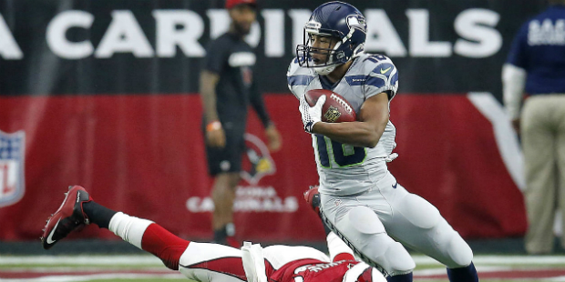 Seattle Seahawks wide receiver Tyler Lockett (16) breaks the tackle of Arizona Cardinals strong saf...