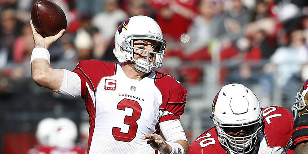 Arizona Cardinals quarterback Carson Palmer (3) looks to pass as tackle Bobby Massie (70) blocks Sa...