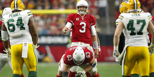 Arizona Cardinals quarterback Carson Palmer (3) looks over the Green Bay Packers defense during an ...