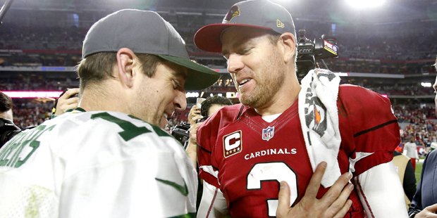Arizona Cardinals quarterback Carson Palmer (3) greets Green Bay Packers quarterback Aaron Rodgers ...