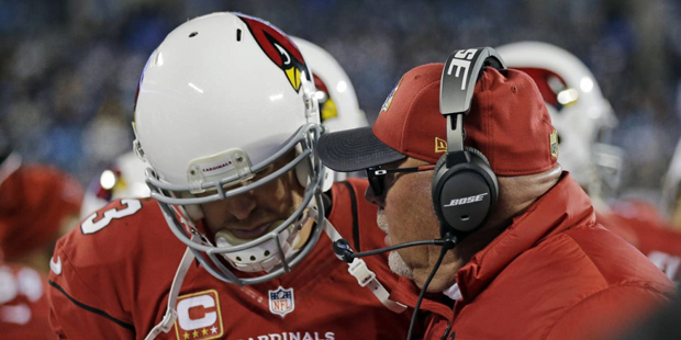 Arizona Cardinals head coach Bruce Arians talks to Carson Palmer during the second half the NFL foo...
