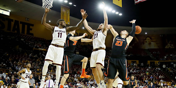 Oregon State's Gligorije Rakocevic (23) battles Arizona State's Savon Goodman (11) and Eric Jacobse...