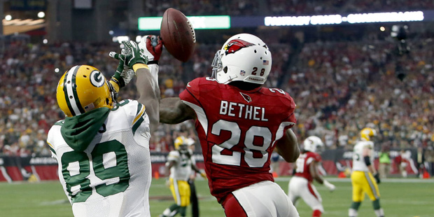 Arizona Cardinals cornerback Justin Bethel (28) intercepts a pass intended for Green Bay Packers wi...