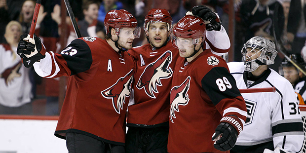 Arizona Coyotes' Oliver Ekman-Larsson (23), of Sweden, and Mikkel Boedker (89), of Denmark, celebra...