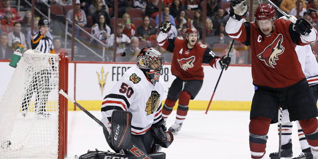Arizona Coyotes' Shane Doan, right, and Oliver Ekman-Larsson (23), of Sweden, celebrate a goal by t...