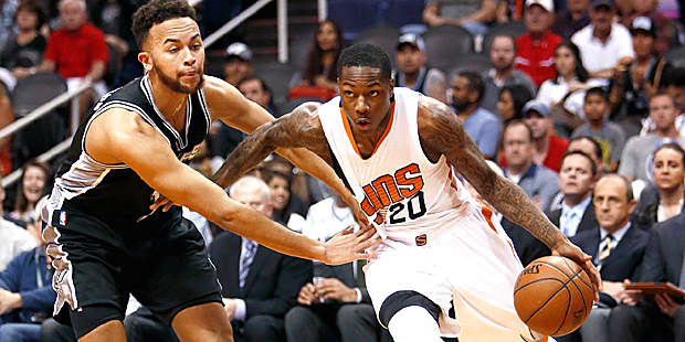 Phoenix Suns guard Archie Goodwin (20) drives past San Antonio Spurs forward Kyle Anderson in the s...