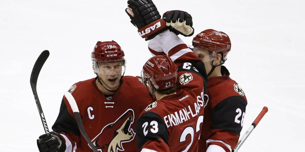 Arizona Coyotes' Oliver Ekman-Larsson (23), of Sweden, celebrates his goal against the Calgary Flam...