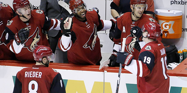 Arizona Coyotes' Shane Doan (19) celebrates his goal against the San Jose Sharks with Alex Tanguay,...