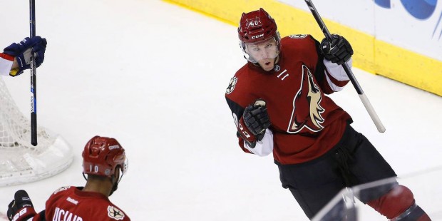 Arizona Coyotes' Alex Tanguay (40) celebrates his goal against the Florida Panthers with Anthony Du...